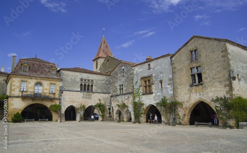 MONPAZIER, FRANCE - SEPTEMBER 10, 2015: Main square in the bastide of Monpazier, Dordogne, France, September 2015