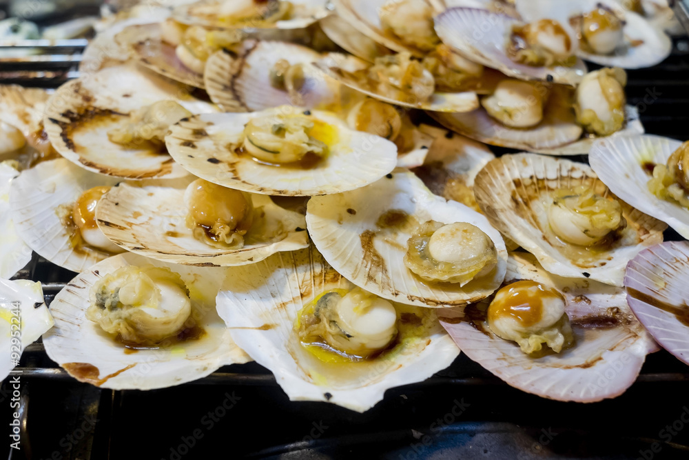 Grilled scallops topped with butter, garlic and parsley. Grilled scallops topped with butter, garlic and parsley.