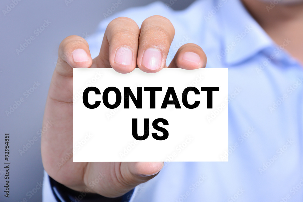 CONTACT US message on the card shown by a man CONTACT US message on the card shown by a man