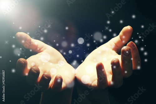 Light in human hands in the dark,  miracle concept
