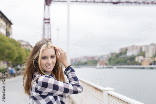 Portrait of beautiful cheerful young woman lookinh at camera.