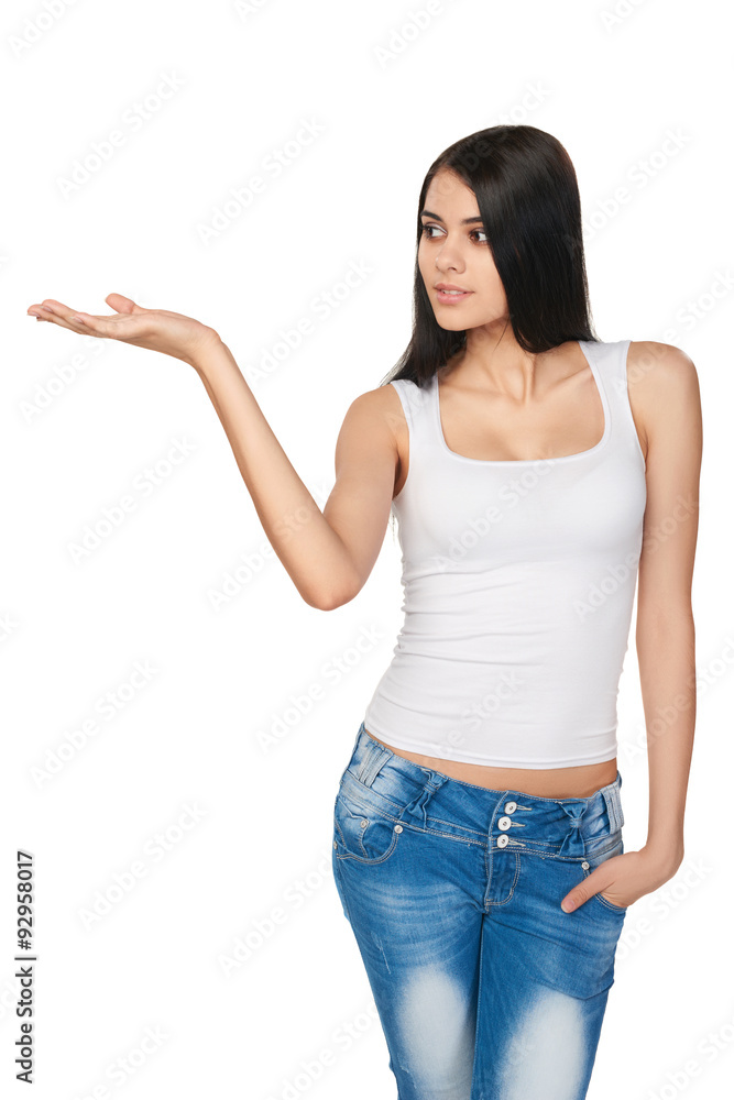 Smiling teen girl showing open hand palm with copy space Smiling teen girl showing open hand palm with copy space