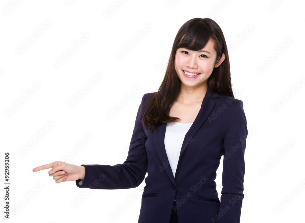 Businesswoman showing finger point aside Businesswoman showing finger point aside
