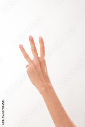 Woman showing three fingers © Svyatoslav Lypynskyy