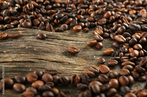 Roasted coffee beans on wooden background