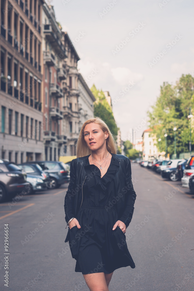 Beautiful girl posing in the city streets Beautiful girl posing in the city streets