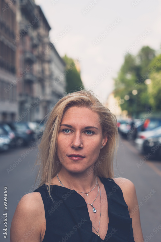 Beautiful girl posing in the city streets