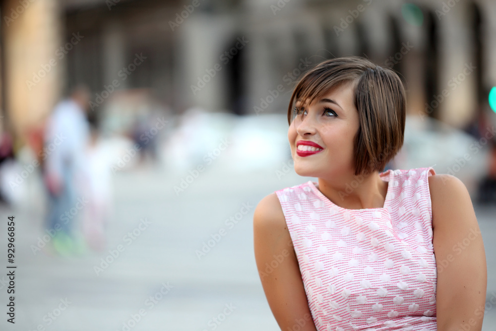 Portrait of smiling girl in urban background