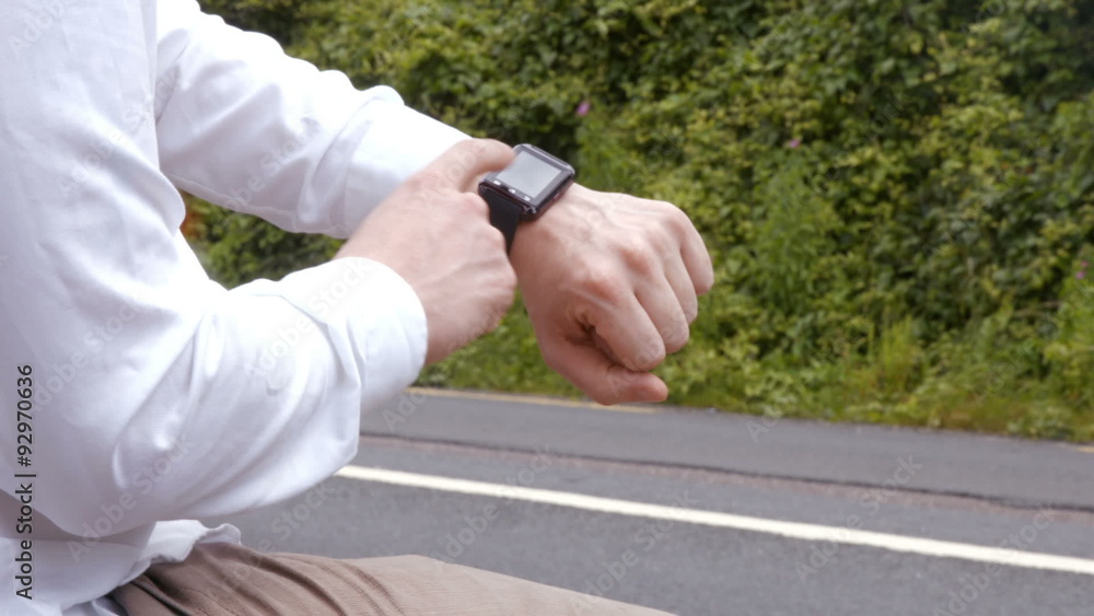 Man using his smart watch Man using his smart watch