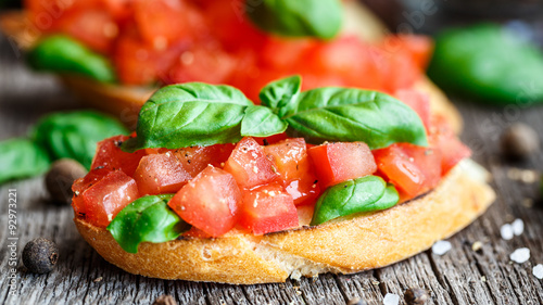 Bild auf Leinwand Tomato bruschetta with tomatoes and basil