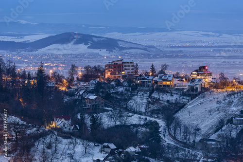 Gloomy winter evening fall over the surroundings of Brasov city, Romania.