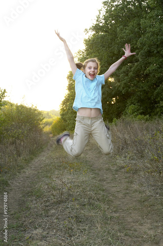 Young jumping girl portrait