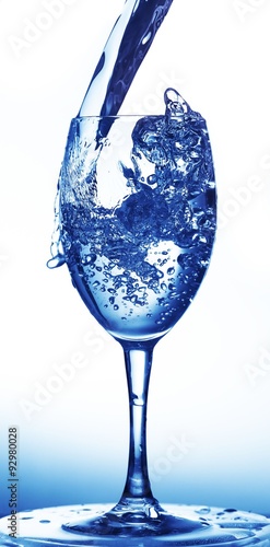 Water being poured into a wine glass