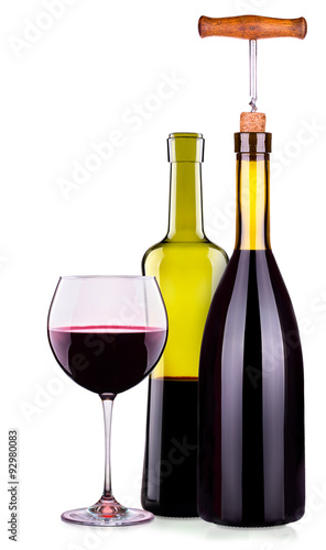 Elegant red wine glass and bottle isolated
