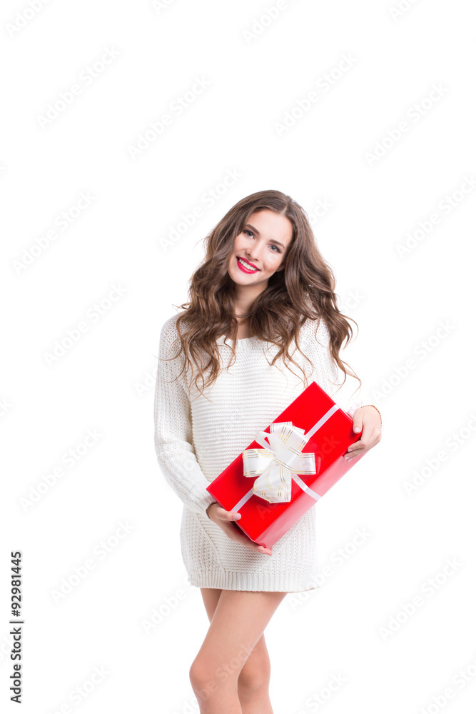 Beautiful woman in white sweater holding a red box with a gift. Beautiful woman in white sweater holding a red box with a gift.