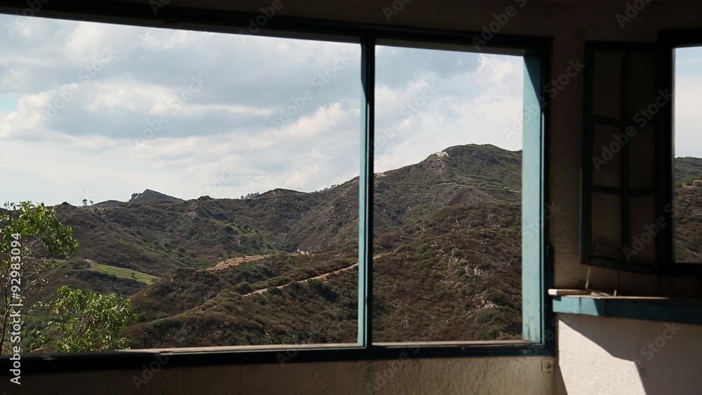 Beautiful landscape out of wide window of an abandoned hotel Beautiful landscape out of wide window of an abandoned hotel