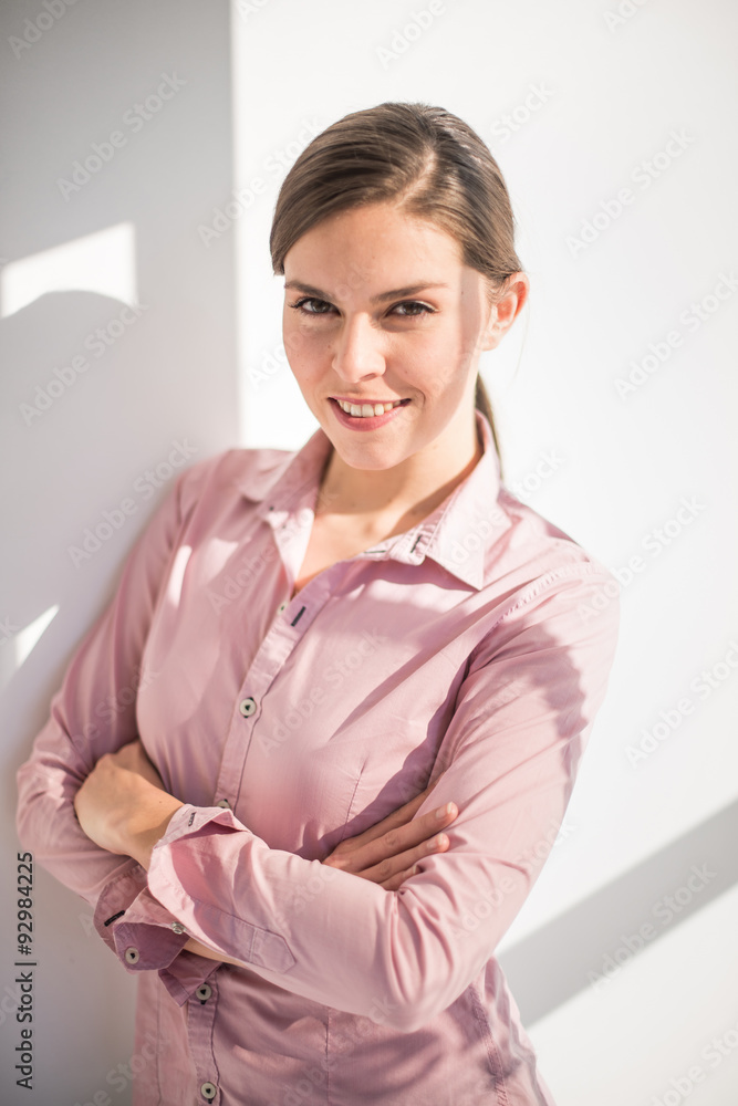 Portrait of a charming woman in her thirties. Her dark hair are Portrait of a charming woman in her thirties. Her dark hair are