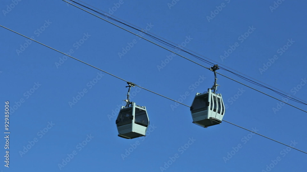 Cabins of cableway in sky background Cabins of cableway in sky background