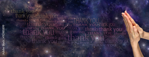 A Prayer of Thanks to the Universe     - Female hands in prayer position on a deep space background with the words 'Thank You' streaming across the page 