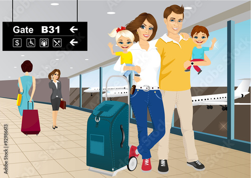 happy couple with children in an airport 