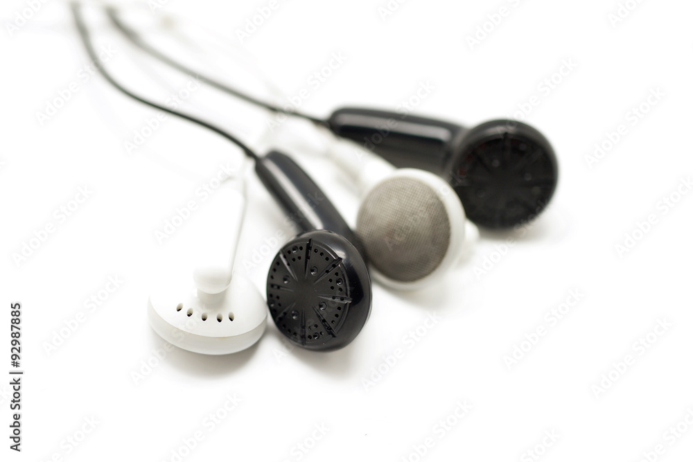 black and white earbuds isolated on white black and white earbuds isolated on white