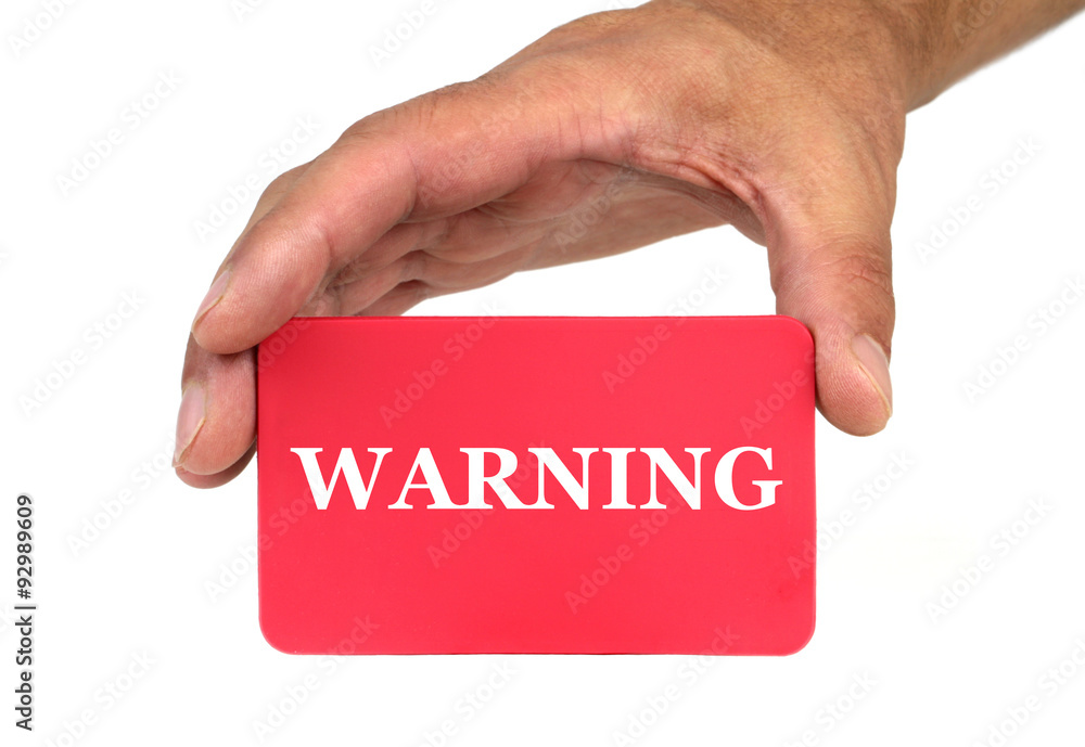 Hand holding and showing a red card with Hand holding and showing a red card with