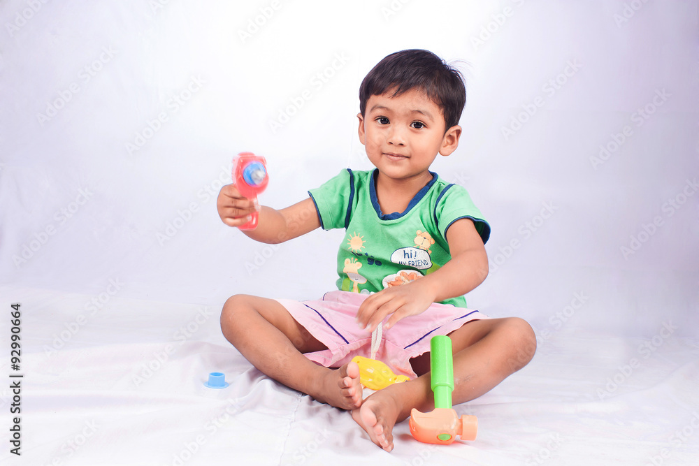 little asian boy play toy tool plastic on white background little asian boy play toy tool plastic on white background