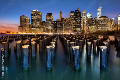 New York Financial District with Freedom Tower still under construction and an old Brooklyn pier