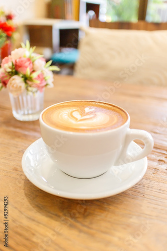 Cup of coffee latte art on wood table