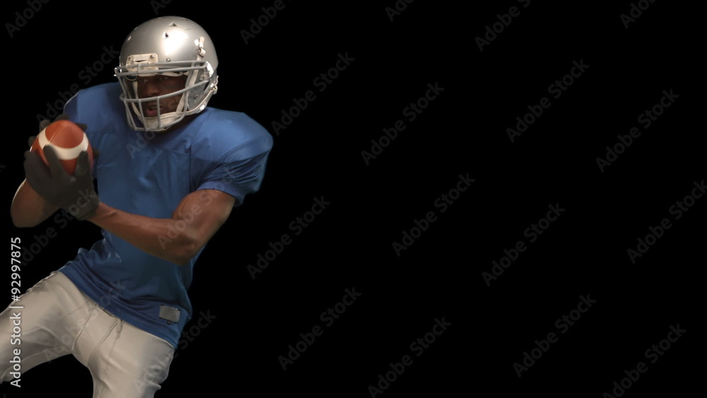 American football player catching ball American football player catching ball