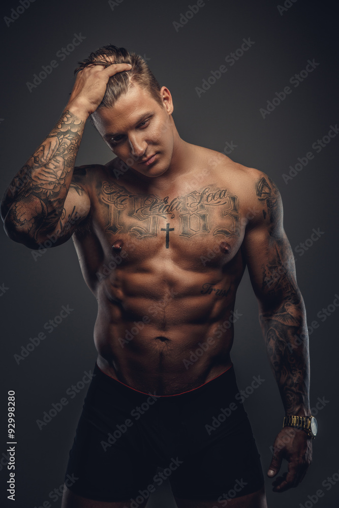Fototapeta premium Strong shirtless tattooed man.