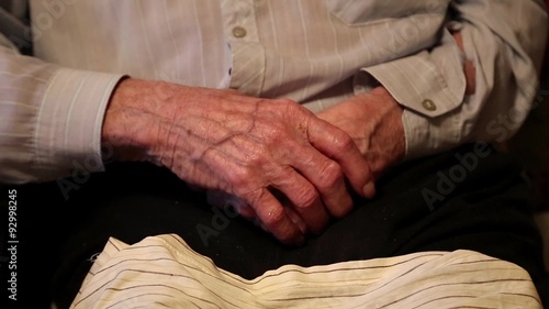 Hands of 93-year old man after two cerebral strokes photo