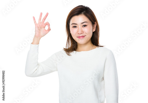 Woman showing ok sign gesture