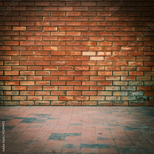 old brick wall weathered texture and dirty floor background