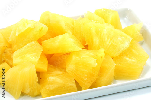 Pineapple slices in a white background.