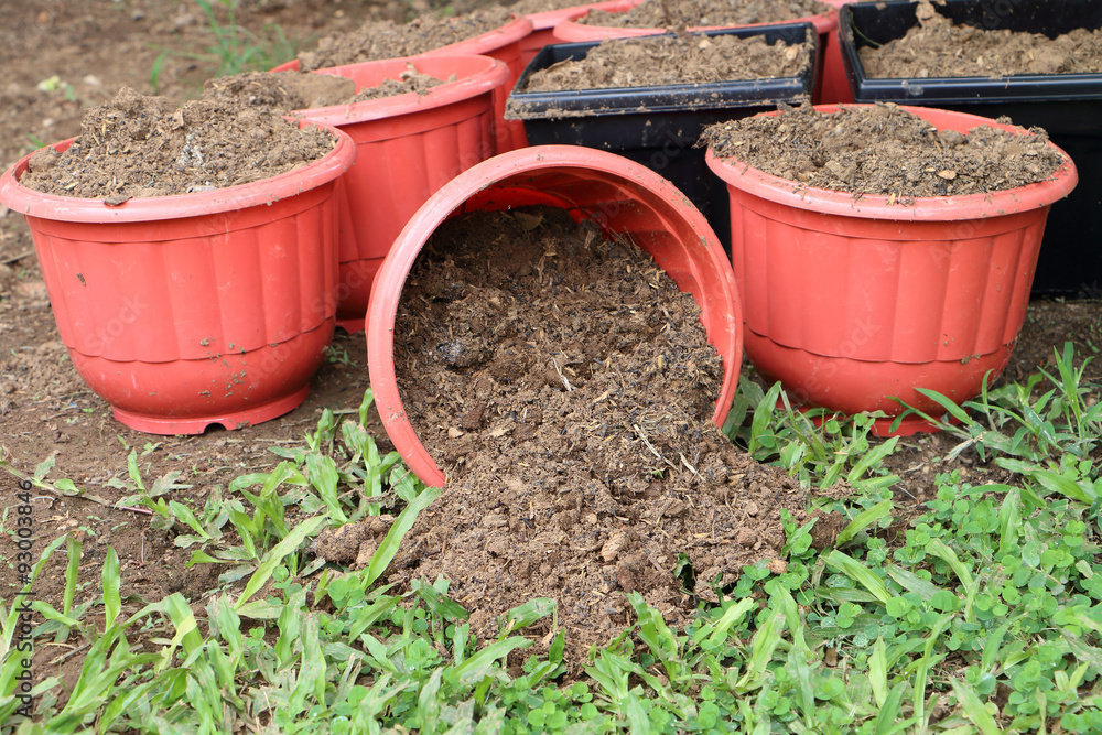 soil pouring from pot soil pouring from pot
