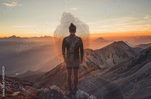 Male hiker observing the sunset at the top of the local big mountain. The photograph was taken in Karavanke mountain range in Slovenia.