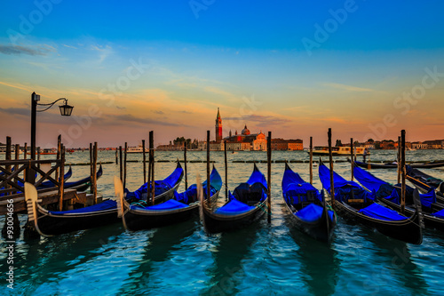 Gondolas in Venice - sunset with San Giorgio Maggiore church. San Marco, Venice, Italy. (filtered) © Gorilla