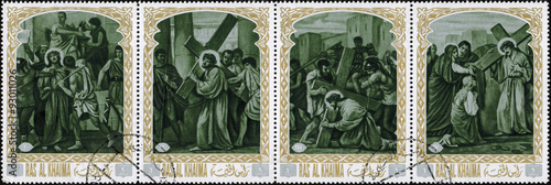 Fotografiet Ras al Khaimah - CIRCA 1972: mail stamp printed in Ras al Khaimah the court, carrying the cross, crucifixion, descent from the cross and burial of Jesus Christ