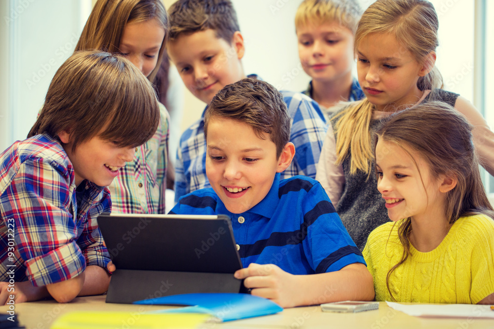 group of school kids with tablet pc in classroom group of school kids with tablet pc in classroom
