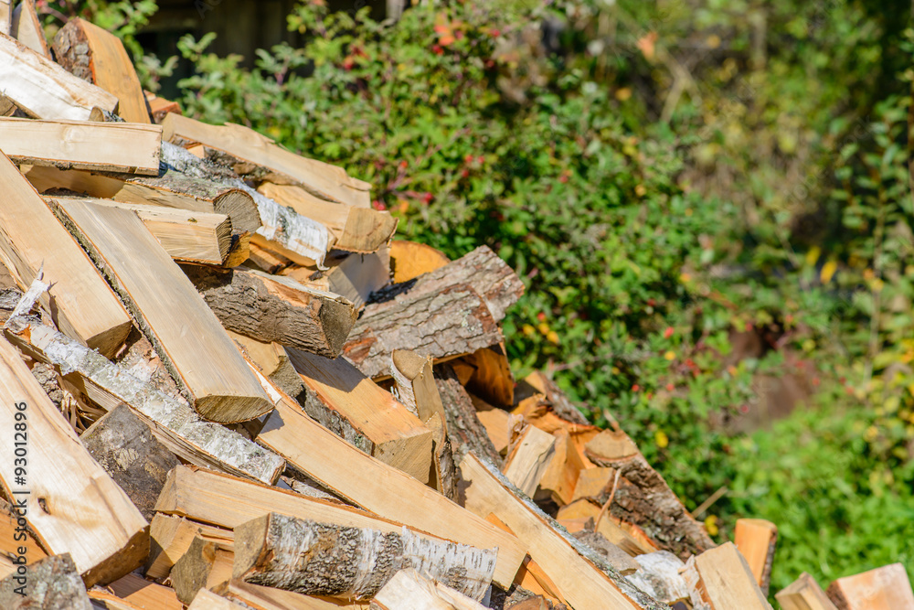 Old axe in log on a firewood background. Shallow depth of field, Old axe in log on a firewood background. Shallow depth of field,