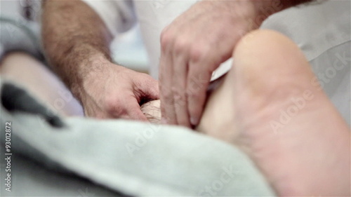 Masseuse at work on a clients leg