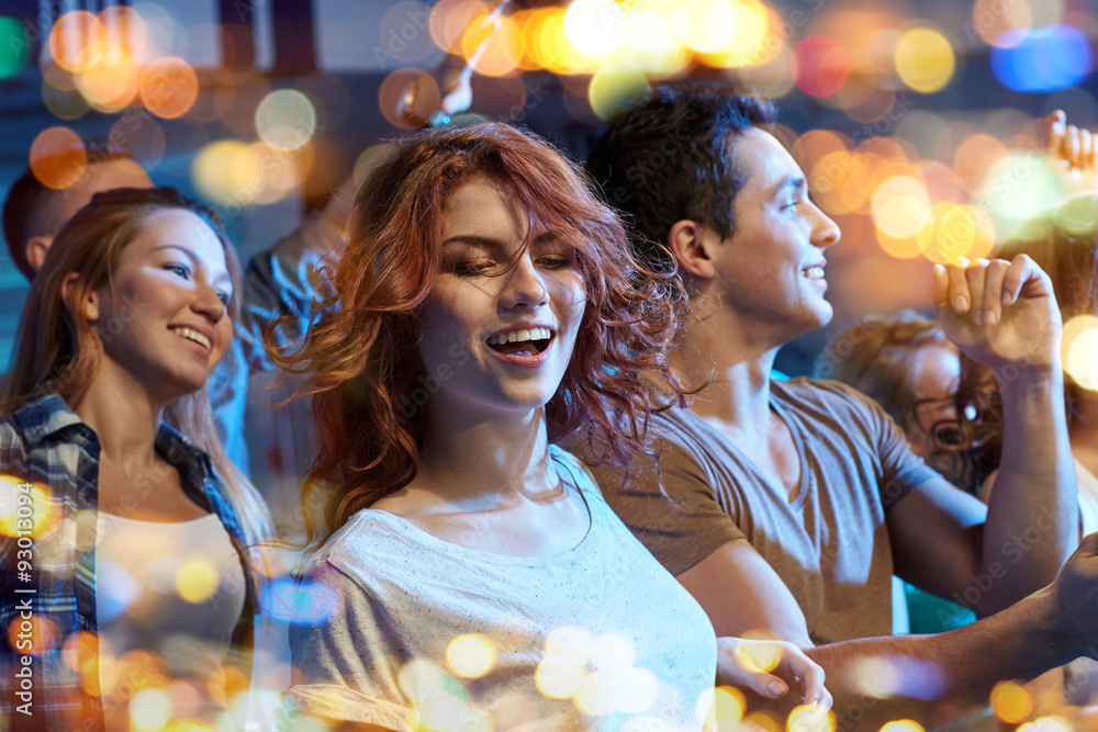 happy friends dancing at night club happy friends dancing at night club