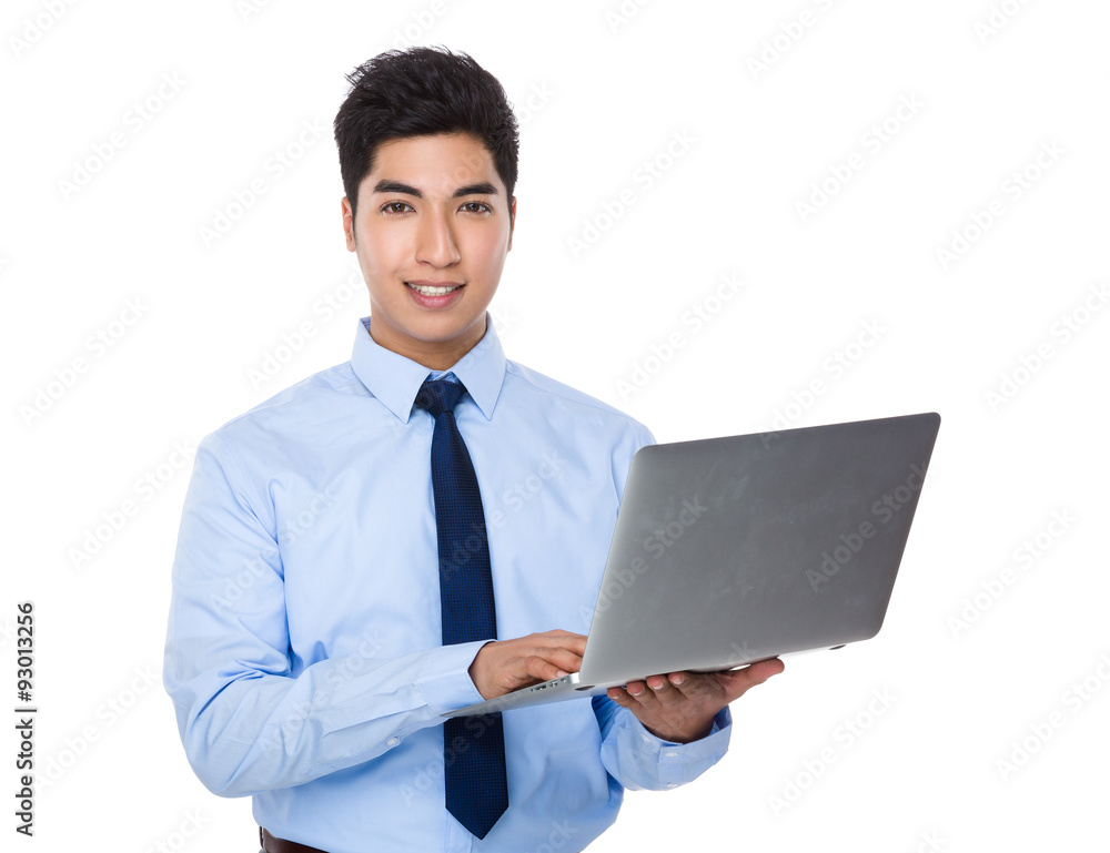 Asian businessman use of the laptop computer Asian businessman use of the laptop computer