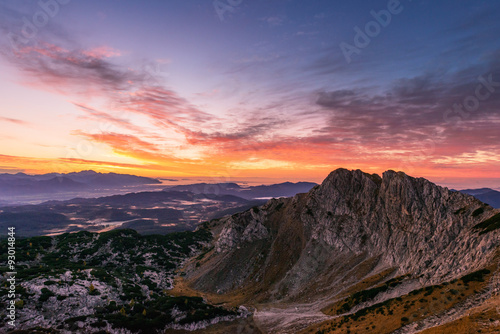 Sunrise in the mountains. Early morning as viewed from the top of Visevnik hill with vast landscape below.