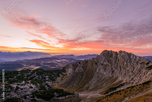 Sunrise in the mountains. Early morning as viewed from the top of Visevnik hill with vast landscape below.