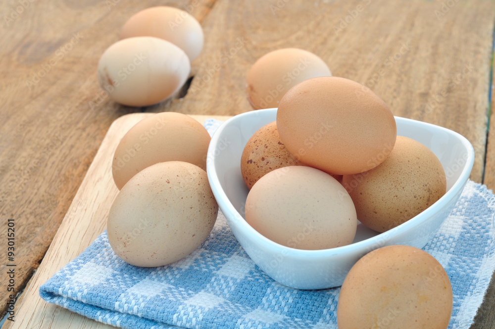 Group of Eggs on the plate and wooden floors. Group of Eggs on the plate and wooden floors.