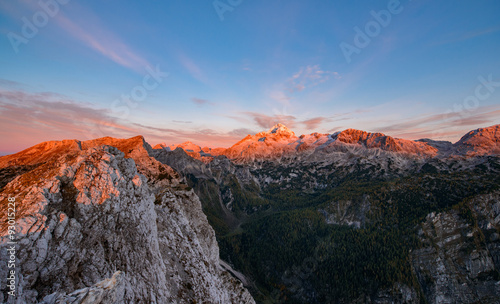 Sunrise in the mountains. Early morning as viewed from the top of Visevnik hill with vast landscape below. © dreamypixel