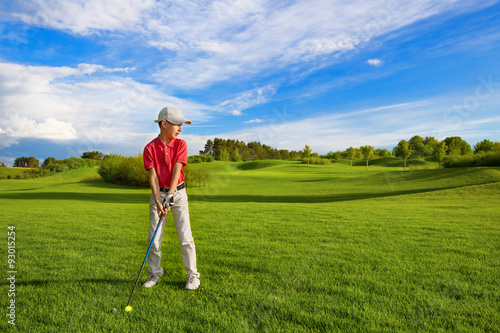 Boy playing golf