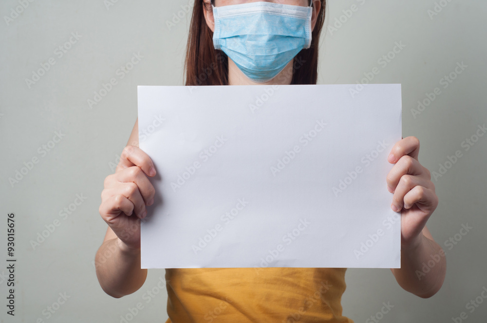 Portrait of Women are Patients wear a mask holds blank paper. Portrait of Women are Patients wear a mask holds blank paper.